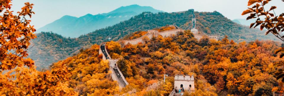 great wall of china against a mountainous autumn background