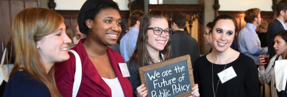 admitted students hold up sign that says we are the future of public policy