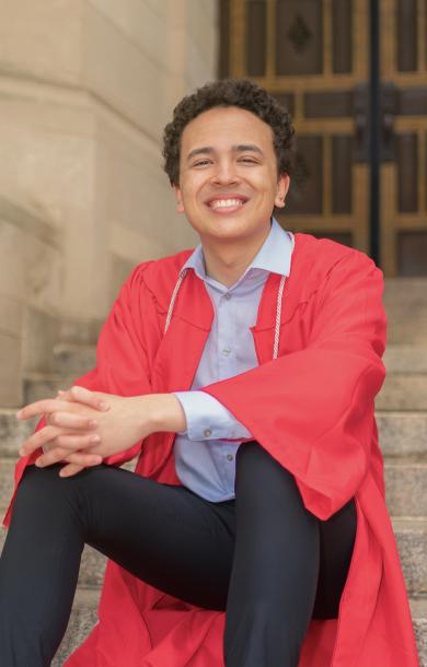 Jonathan Dacosta smiling in undergrad graduation robe