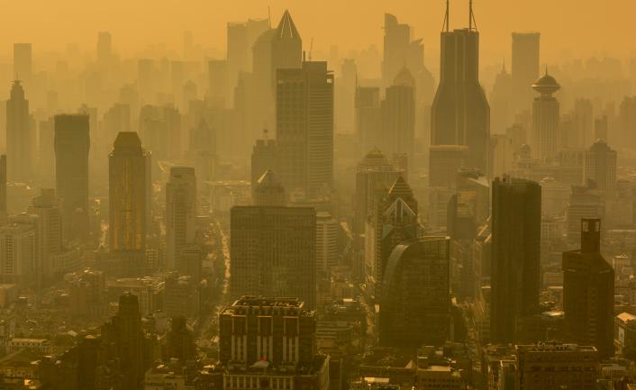 A photo of the city of Shanghai in clouds of pollution.