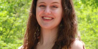 an argumentative text Headshot of Maggie Onsager