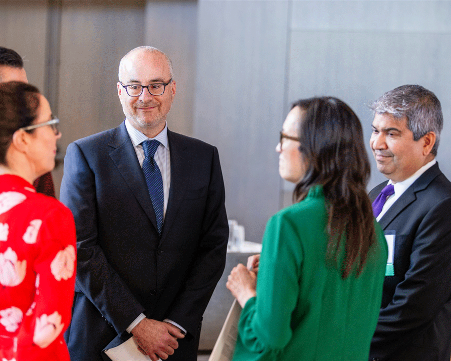 Dean Ethan Buena de Mesquita talking with alumni