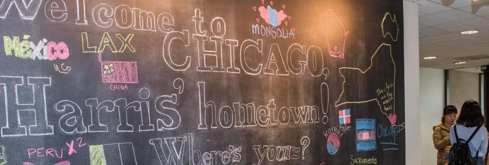 chalkboard with students hometowns written on it