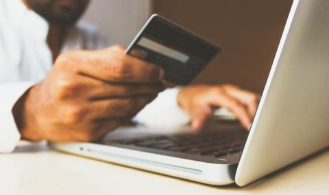 person holding credit card