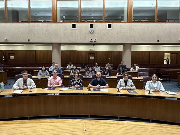 The Fellows in the City Council Chambers in City Hall