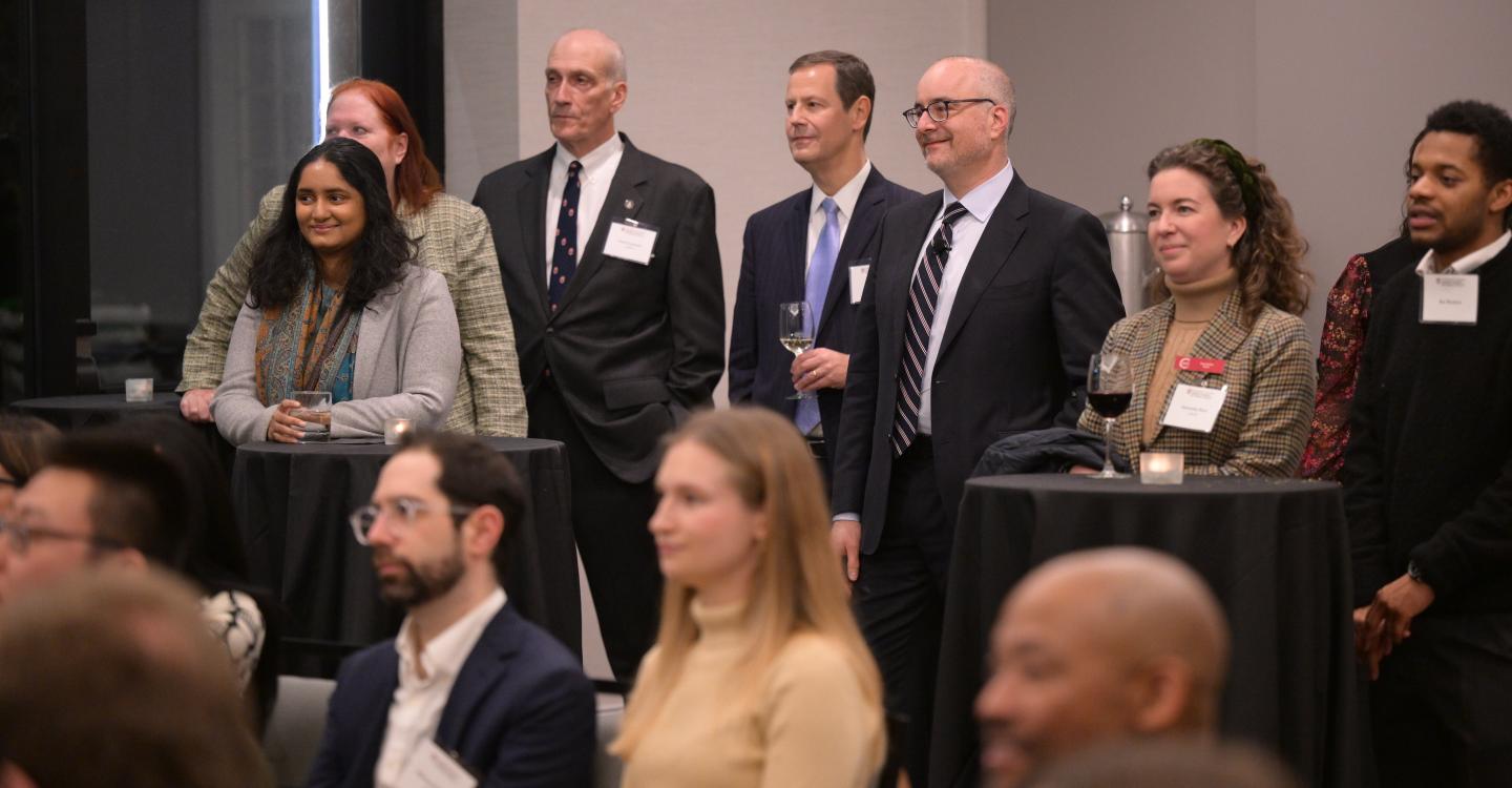 Dean Ethan Bueno de Mesquita and event attendees