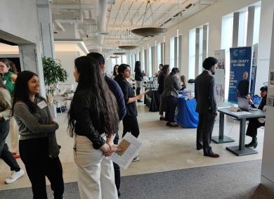 Students line up at employer booths in Keller Center
