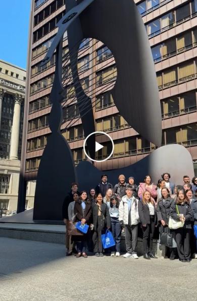 students in front of the picasso downtown cheer local government day