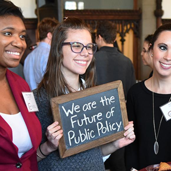 admitted students holding sign "we are future of public policy"