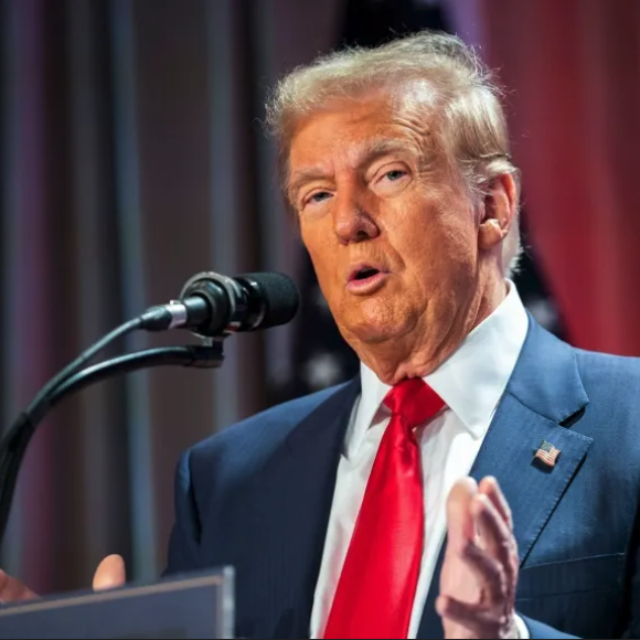 Donald Trump talking into a microphone